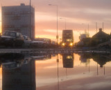 London  Bus, Route  number 128,  in  the  dawn, reflected.