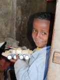 A young boy, proud of his toy.