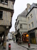 half-timbered buildings project over the streets...