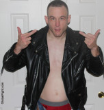 leather cocky gay jock shooting finger.jpg