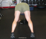 big man bending over gym training.jpg