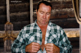 a hot farmer man removing shirt barn toolshed.jpg