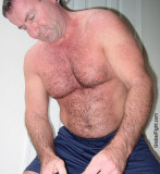 dad sitting on floor bedroom shirtless.jpg