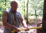 muscular older tough daddie chopping wood.jpg