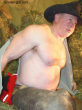 cowboy rancher undressing hay barn.jpg