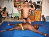 wrestler flexing over knocked out opponent.jpg