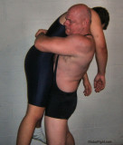 carrying man bearhugging gay wrestler.jpg