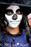 Girl dressed as Catrina in parade