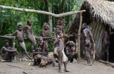 The Yakel re-segrigate to relax by the men's hut after the dancing