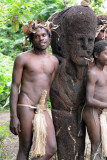 Young Yakel men posing with the village icon