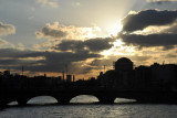 Sunset over the River Liffey with the dome of Four Courts and the Grattan Bridge
