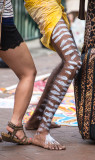 Aboriginal busker legs and female leg