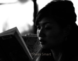 Young woman reading on Manly ferry