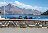 Female tourists on wall at Queenstown 