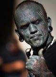 Heavily tattooed man in close up