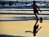 playing soccer, Sao Bien public beach, Danang, Vietnam 