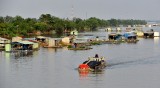 barge and fish farms, Mekong River,  Vietnam  