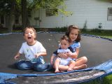 Sarah, Kyle, and Noah on the Trampoline
