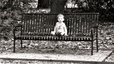 Sitting On A Bench, On A Lonely Sunday Morning. So Small, So Innocent, In A Great Big World.