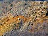 Mine site at Panagyurishte Dozer close up across valley