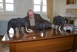 The mayor of Siatista studies the models like a real scientist