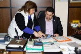 Evangelia showing the prefect a recent publication on the Milia museum