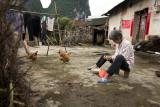 Lady preparing dinner in a village in Xing Ping, Guangxi, China.