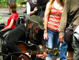 Musicians concentrated and distracted tourists