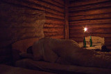 Our wooden hut lit by candle light