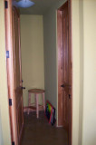 Hallway (to the right of the pantry) to the garage and  utility bath