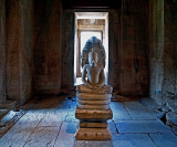 Image of the Buddha under a naga
