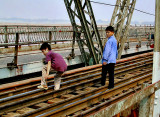 Boys stealing railroad spikes