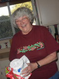 Barbara Sweet (Webster,WI) opening toilet paper gift