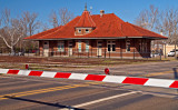 A similar view of the station with a train on the way.