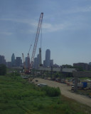 Crane setting the center structure that the canterlevered roadbed will be supported by along with the cables from the arch