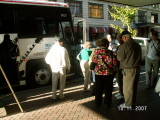Joan and Dave Jordan board tour bus. Don Russell left in the light jacket.
