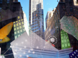 Saks window with Rockefeller reflection