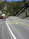 Looking down the road where theyll be riding up to us.