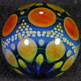 She flameworks the colors in the glass to get that sweet varied striation you see.