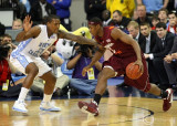 Virginia Tech F Allen attempts to drive on North Carolina F Thompson