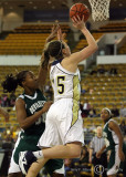 Yellow Jackets F Ardossi drives past Devilettes F Arlivia Young on her way to a basket