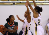 Georgia Tech G Montgomery gets help from G Foster to defend Miami G Johnson