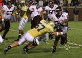 VA Tech TB Kenny Lewis is stopped by Jackets LB Shane Bowen