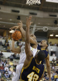 Jackets F Smith goes up strong against the Spartans defense