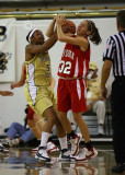 Tech G Jill Ingram fights for the ball with Wildcats G Gassie