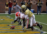 UGA PR Mikey Henderson recovers his muffed punt and is tackled by Tech S Morgan Burnett