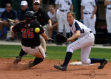 Yellow Jackets 3B Brittany Barnes takes the throw in an attempt to nail the sliding UGA IF Alisa Goler
