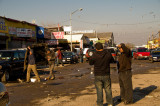 workers carry glass, discuss problems