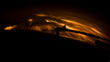 The night-lit cities gliding underneath