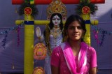 Bengali Girl Poses with Saraswati Statue.jpg